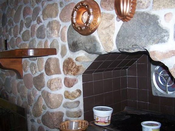 Rock fireplace in kitchen