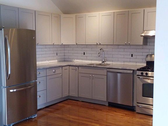 New Modern Open Kitchen with stainless steel appliances