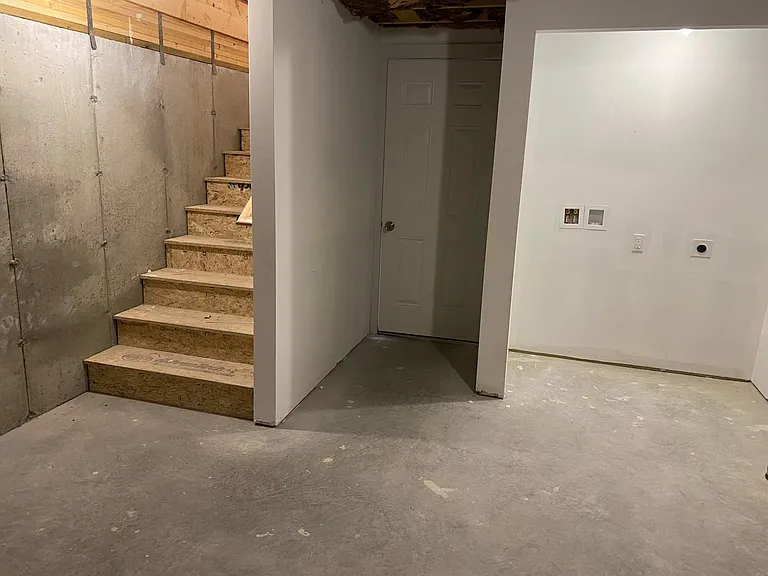 entry from garage to basement, stairs to living level