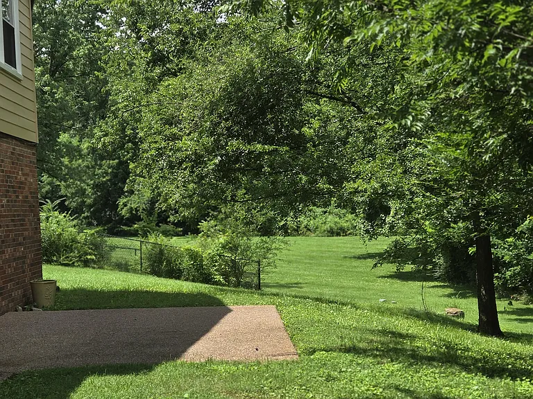 Back yard with patio off of lower rec room