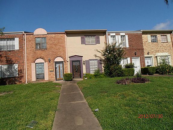 IMPRESSIVE VIEW OF COUNTRY CLUB VILLAGE CONDOMINIUMS. ONLY 14 HOMES IN THIS WELL PLANNED PROPERTY.