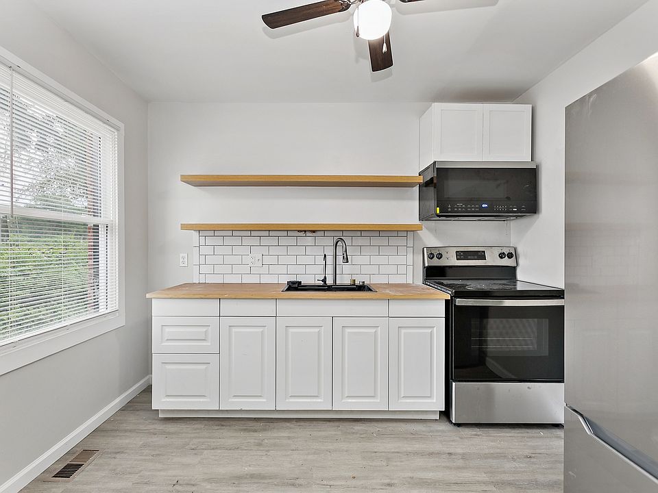 Functional Kitchen _ A practical kitchen with ample room for meal preparation, storage, and everyday cooking. Modern fully renovated new stainless steel appliances and microwave included. Vented hood and ceiling fans throughout the spack.