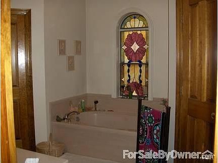 Masterbath with walk-in closets
						:
						Jetted tub,tile floors,climate control walk-in closets(stain glass not included)