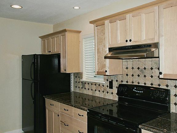 Lots of counter space in this kitchen, for sure!! Natural light in the kitchen is abundant, and repl