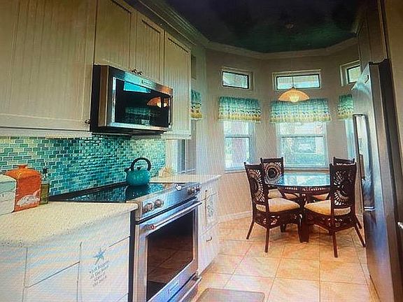 Dine in kitchen with stainless steel appliances