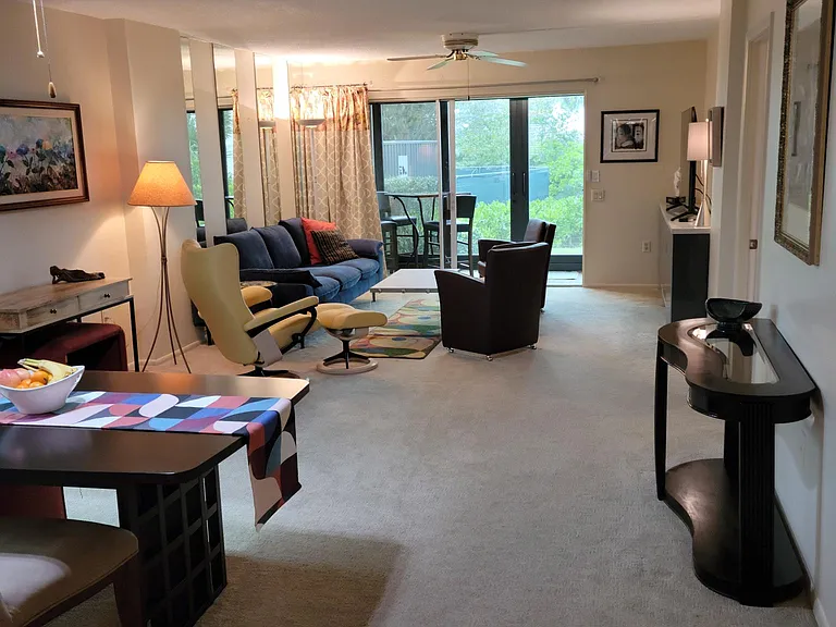 The great room with the lanai and backyard in the back ground