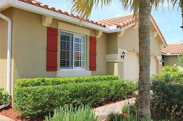 Impeccably maintained home - beautifully landscaped with double hedge