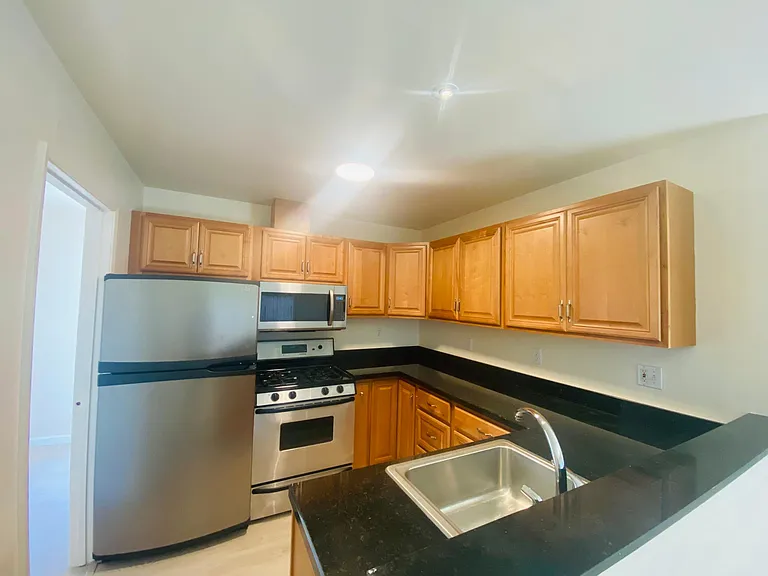 Kitchen - New range and stove top installed. Pictures depict old appliances.