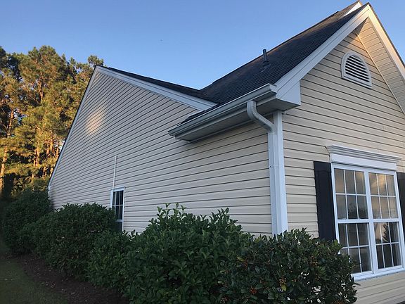 Guttering and landscaping on side of house.
