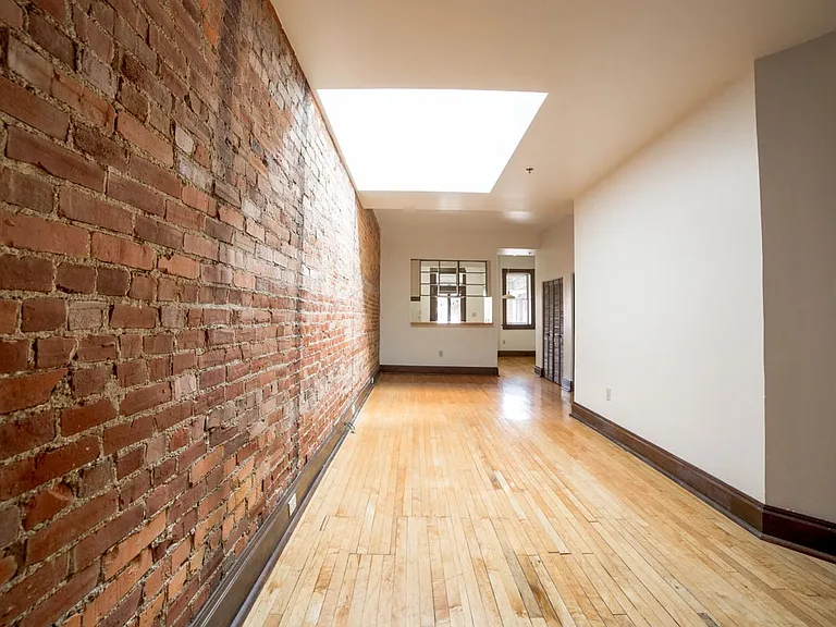 Living Area with Exposed Brick