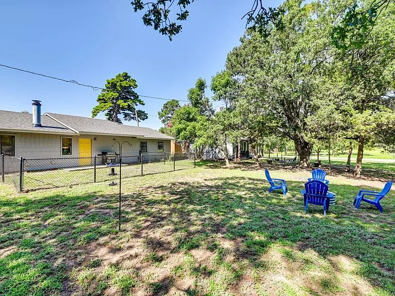 Backyard, firepit and chairs.