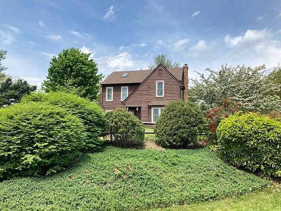 Home is set on a knoll overlooking the neighborhood