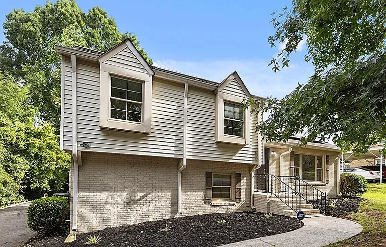 Front of home with inviting entry and fresh landscaping