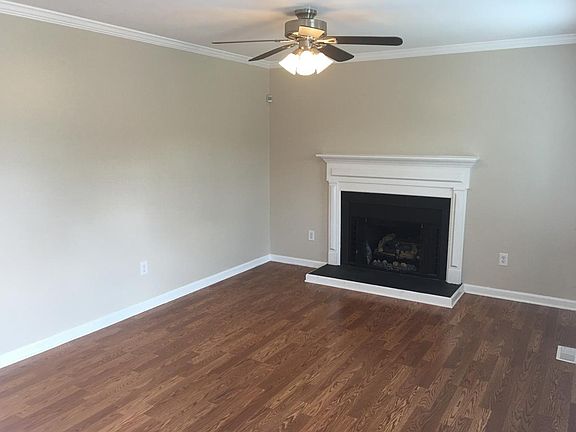 Spacious living room with gas logs