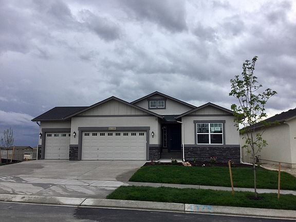 Craftsman 3-Car Photo representing home to be built and may demonstrate optional features