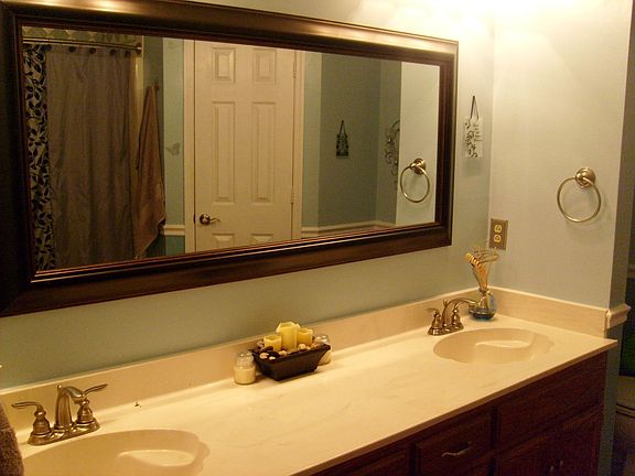 Refreshed master bathroom with his and her vanities & walkin closets