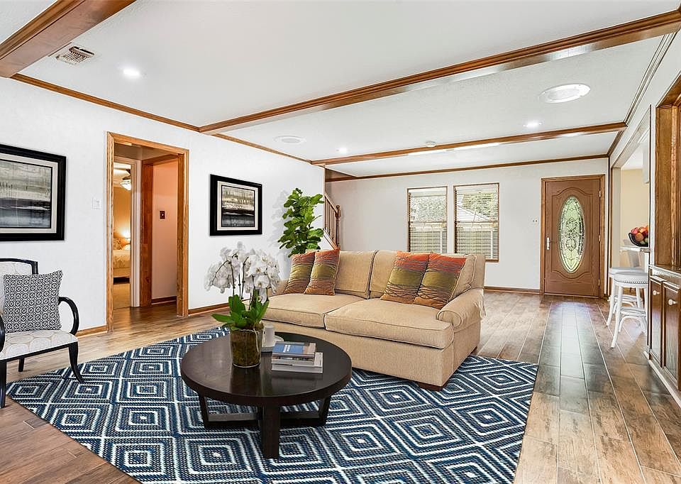 WOW, what a large Den with gorgeous, updated wood look tile flooring.