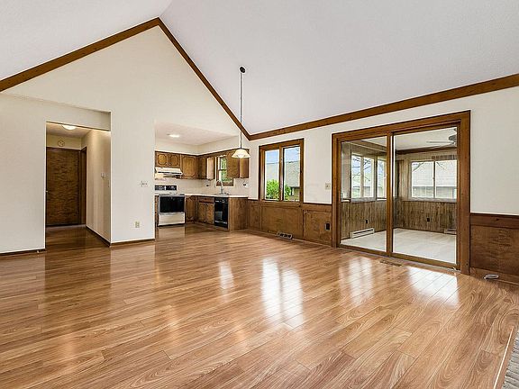 Great room as viewed toward kitchen & 3 season room