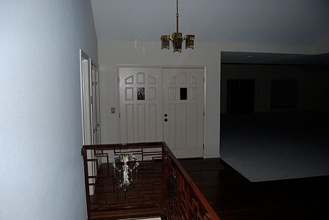 Striking entry with newly refinished wood floors