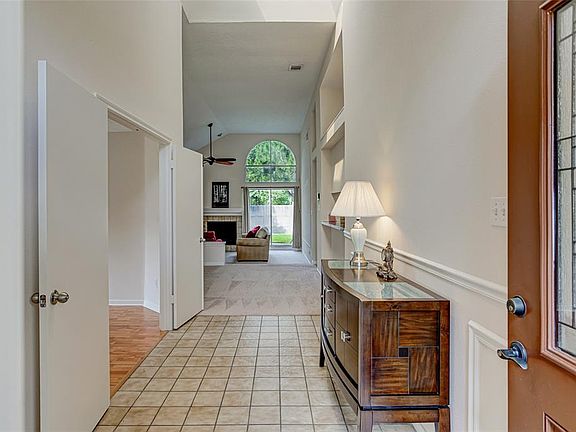Welcome home! Step in to a tile foyer and high ceilings. Wainscotting makes a nice touch!