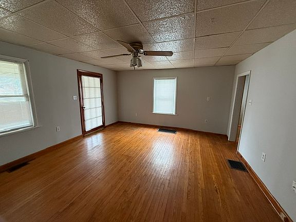 Large living room with wood floors