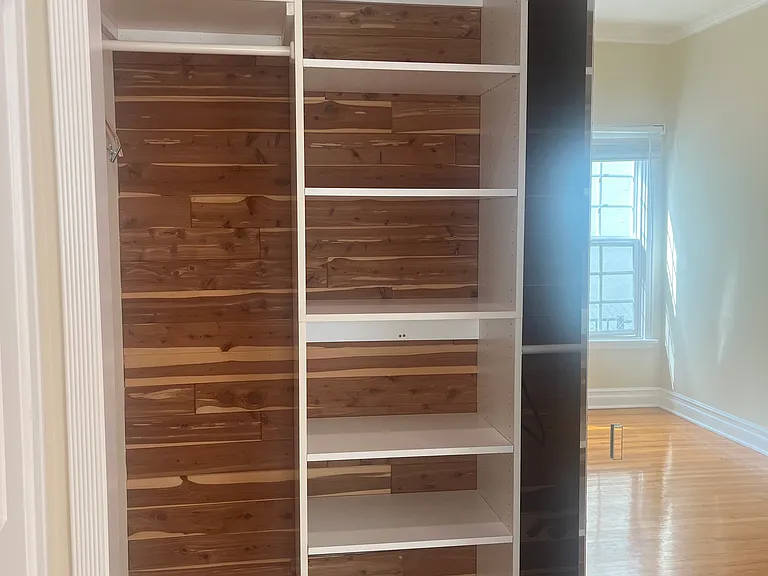 CEDAR LINED CLOSET WITH TONS OF CUSTOM SHELVING AND HANGING SPACE