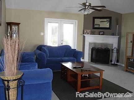 Living Room
						:
						Ceil. fan, fireplace w/mantel, french doors to screened patio.