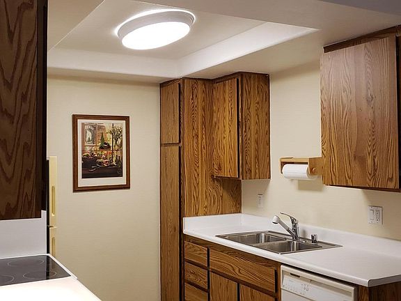 Full kitchen with glass top stove