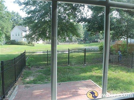 Fenced Rear on Pond Dual Brick Patios