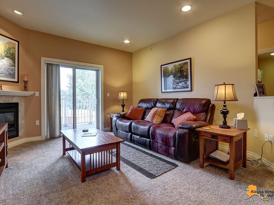 Comfortable Living Room with Leather Couch and Two Relaxing Recliners Built-In!