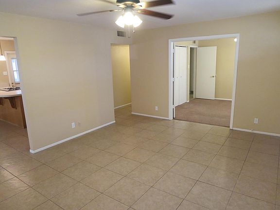View from living room into adjacent bedroom with french door