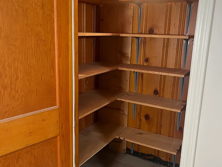 Half of basement storage closet