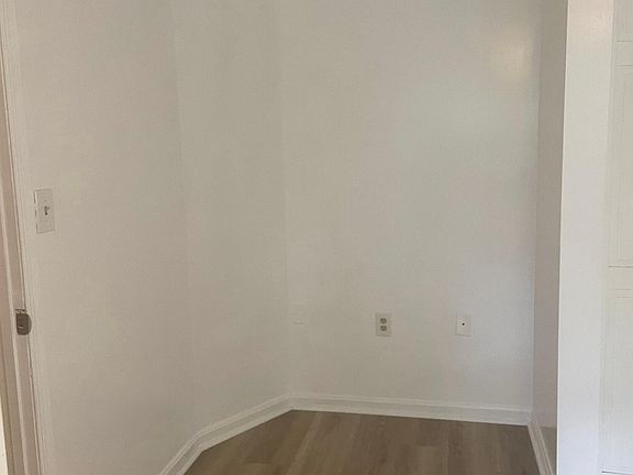 Last image of front bedroom. This corner works well for desk or dresser.