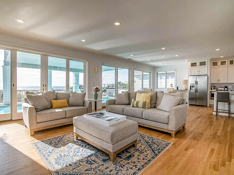 This open layout has a very comfortable and spacious living room out to pool and ocean. There is an additional full bath off living room out with convenient side door out to pool.