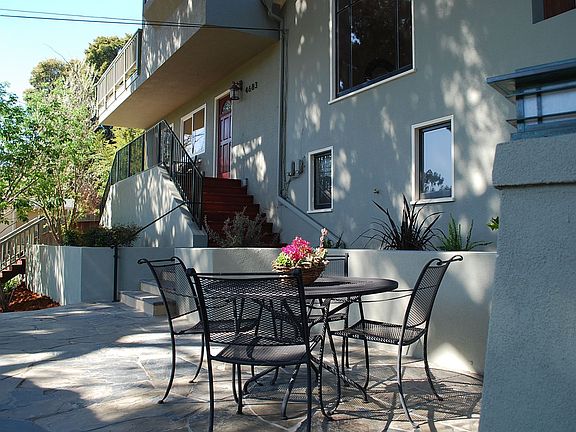 the front flagstone patio creates a perfect setting for dining &amp; entertaining guests