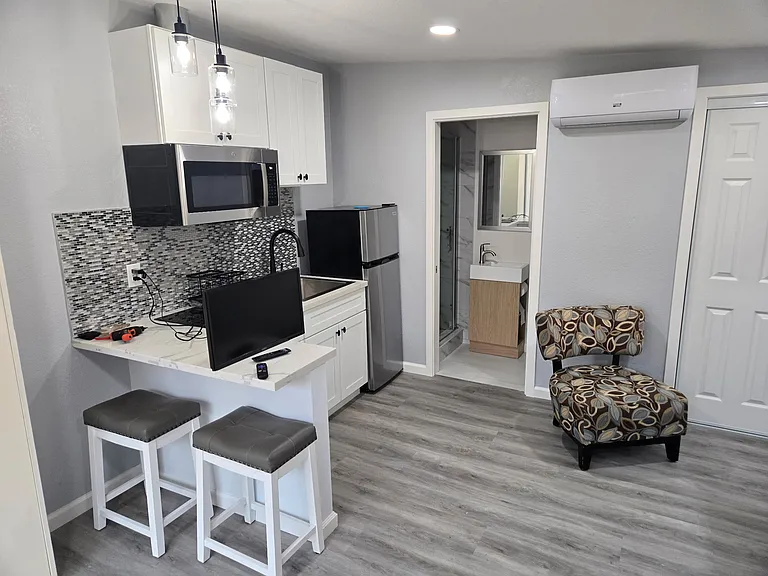 kitchenette and door to bathroom