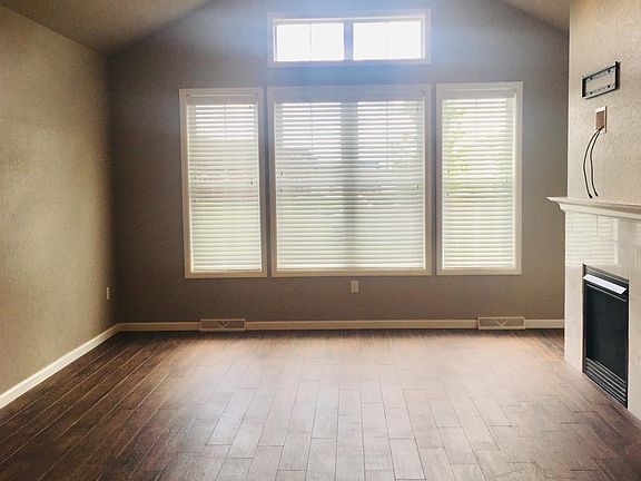 Living Room with fireplace and vaulted ceilings