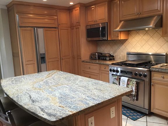 Large marble countertop, subzero refrigerator, Dacor stove, plenty of light from large skylight