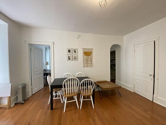 Living room with the bedroom door and the second closet door