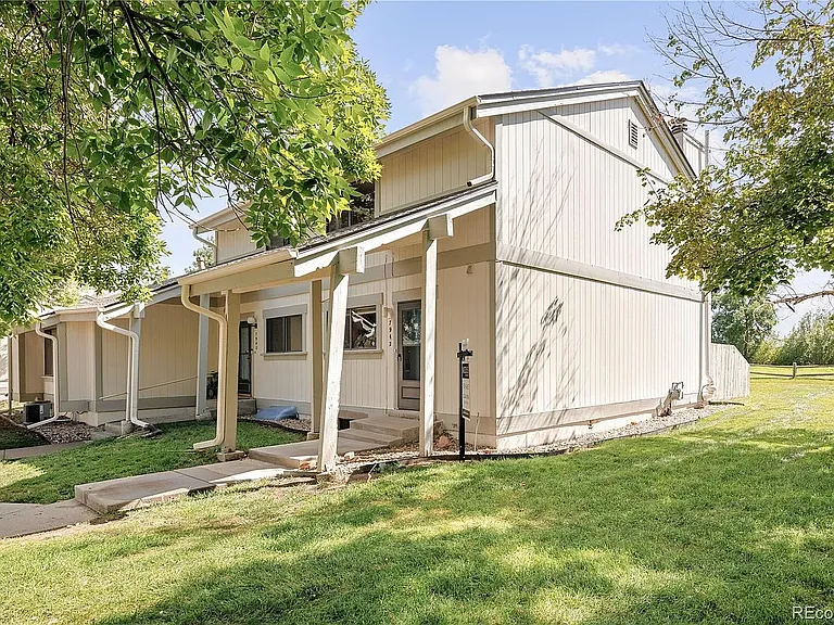 Side of unit, HOA-maintained grass/landscape