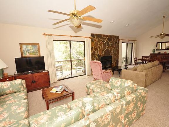 Living room with wood burning fireplace