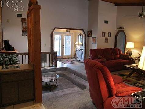 This is not your typical "cookie cutter home"!  Vaulted Ceilings,recessed entertainment area with Fireplace and lots of natural lightening.