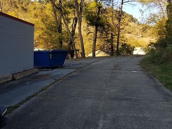 Tennant's trash dumpster and driveway/parking