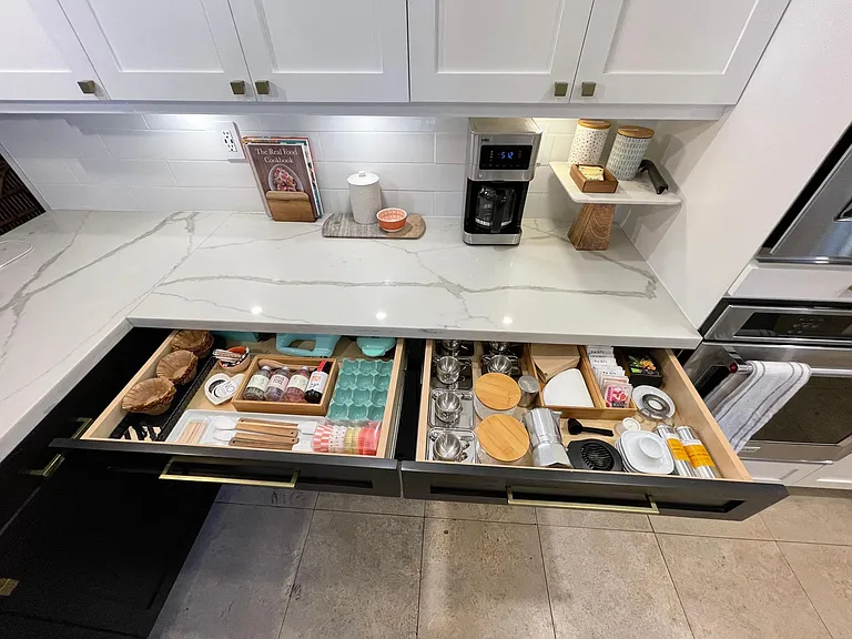 Even narrower top drawers are deep enough to put a good amount of stuff in. I drink lots of coffee and bake a lot so that is what I used these drawers as.