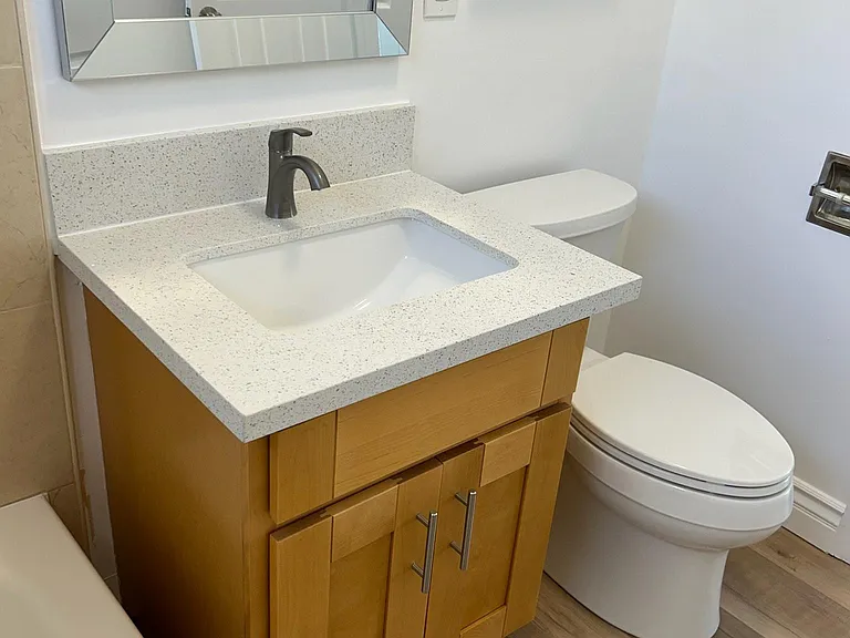 Brand new bathroom vanity quartz counter, faucet, cabinet and low-flush toilet