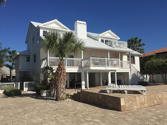 Back of house with 8000 square foot stone paver area
