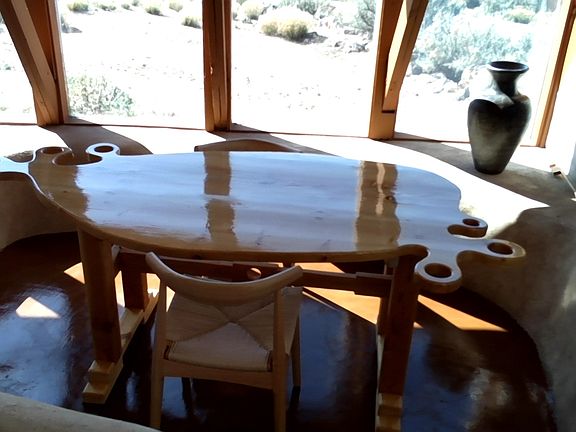 New breakfast nook table and solid wood chairs.