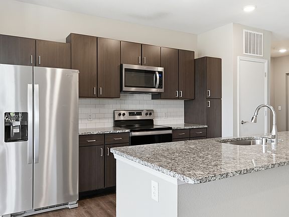 Cook, dine, and gather in a stylish kitchen space.