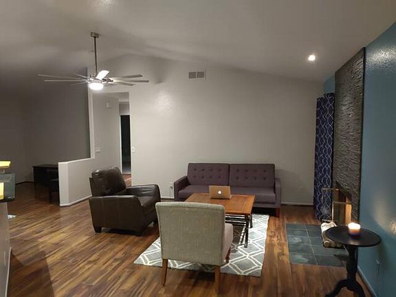 In the back there is a bonus TV room with a day-bed and a desk that can be used as an extra office.