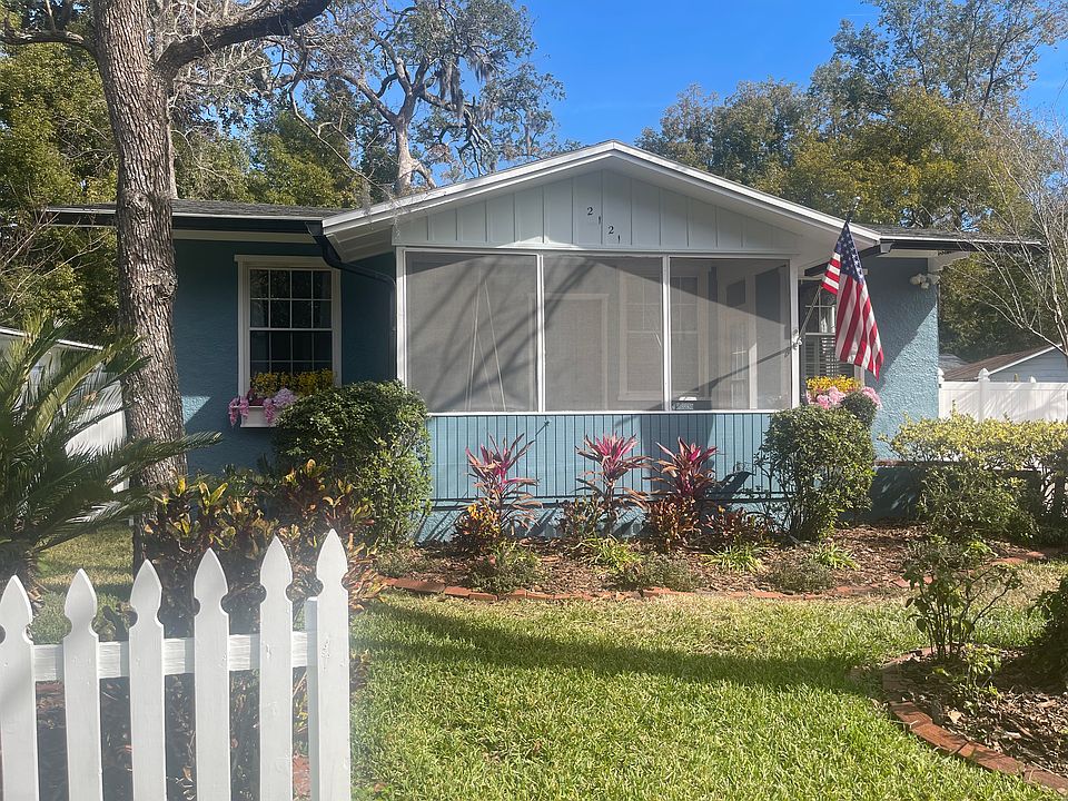 Front yard gardens and screened porch entry